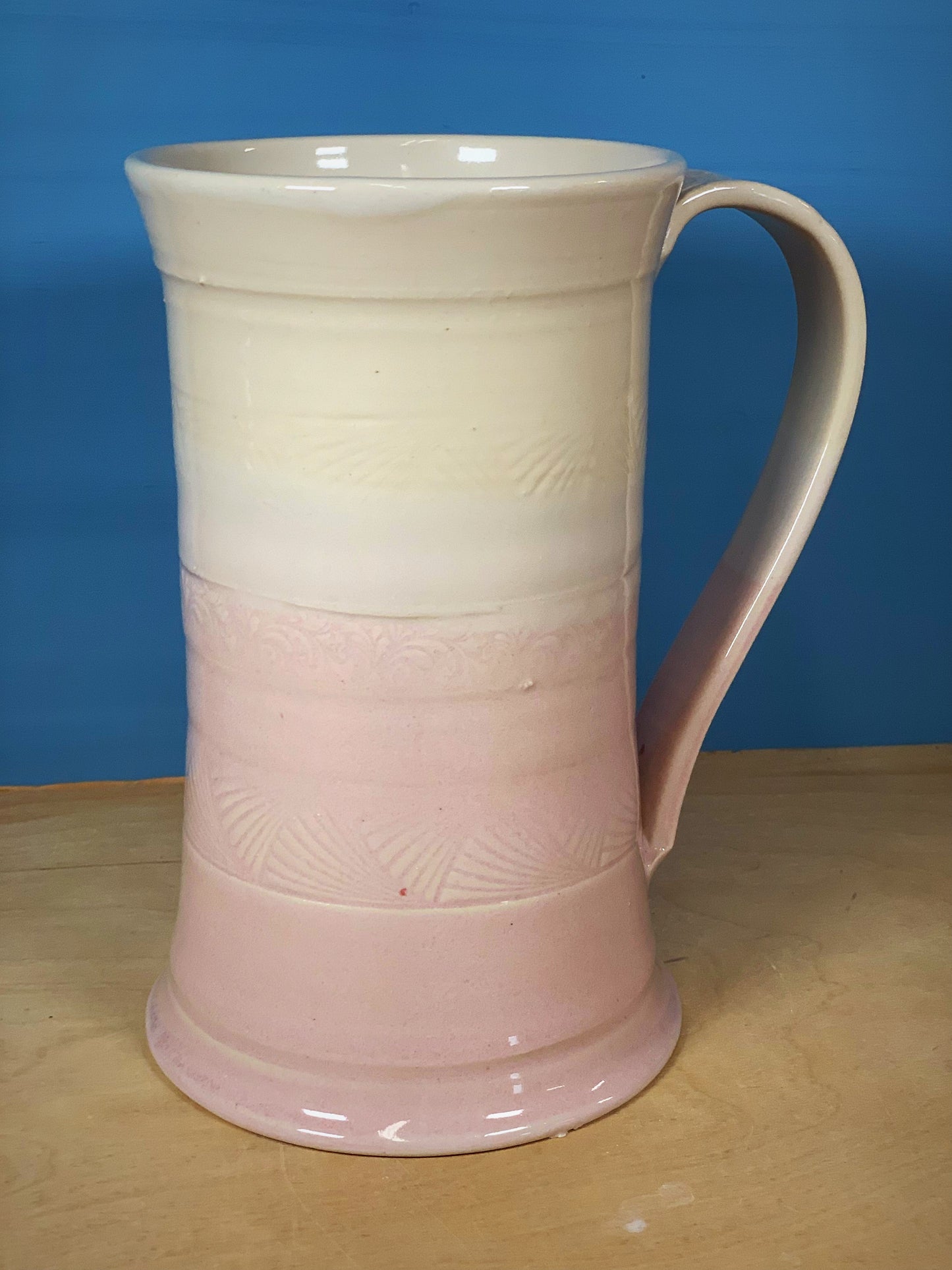 Pink and white stamped beer mug