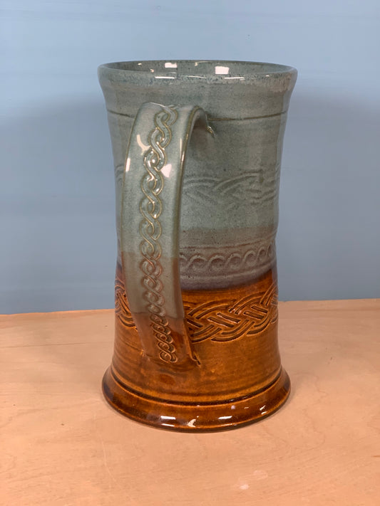 Green and brown stamped beer mug