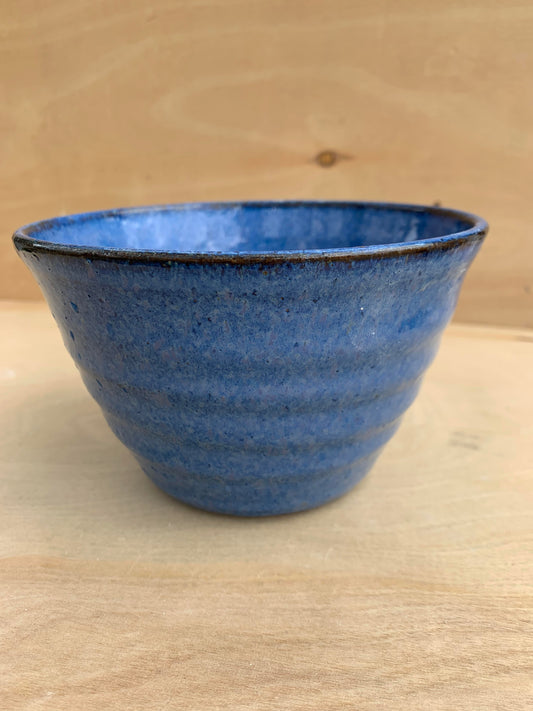 Blue Glaze on red clay bowl.