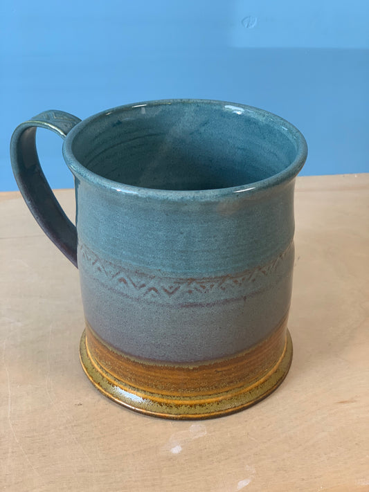 Green and brown detailed coffee mug